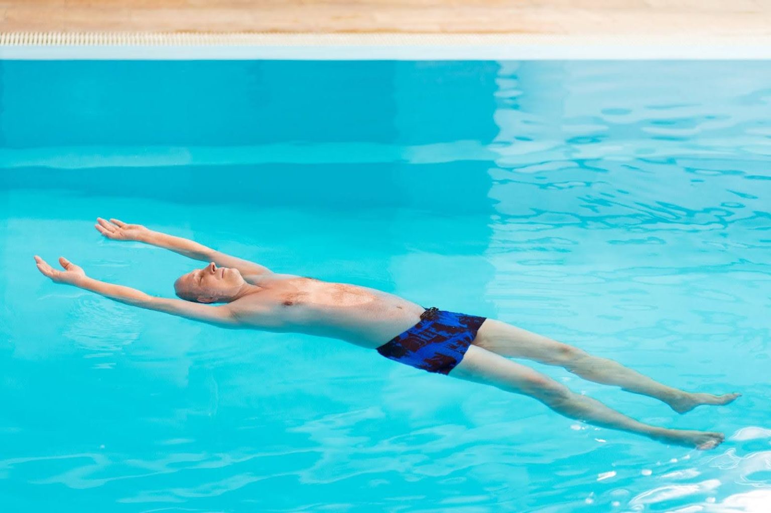Float Feet First With Half Sitting Position How To Float On Your Back: 7-Step Guide For Beginners - SwimHub